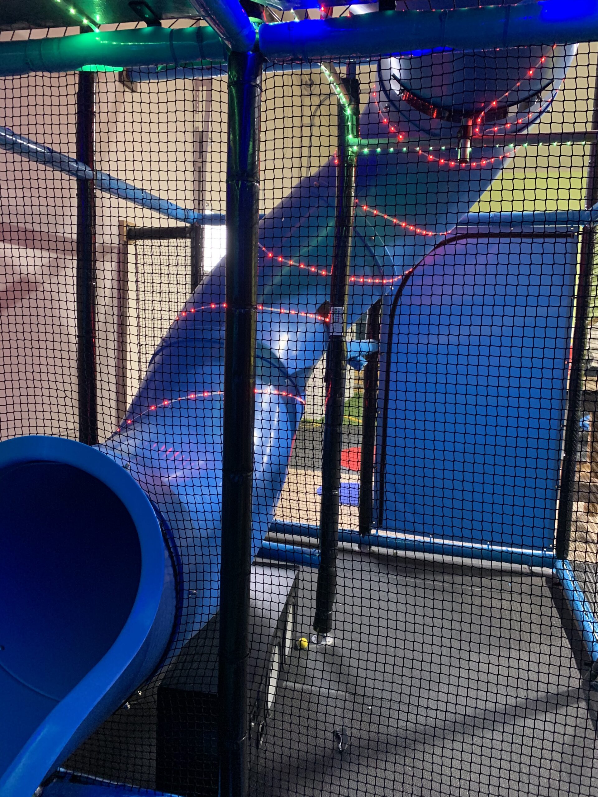 Bouncy Castles and climbing equipment in a room.